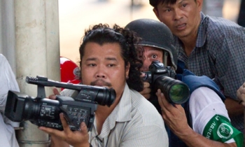 Journalists playing with death while shooting political unrest in Thailand Journalists playing with death while shooting political unrest in Thailand